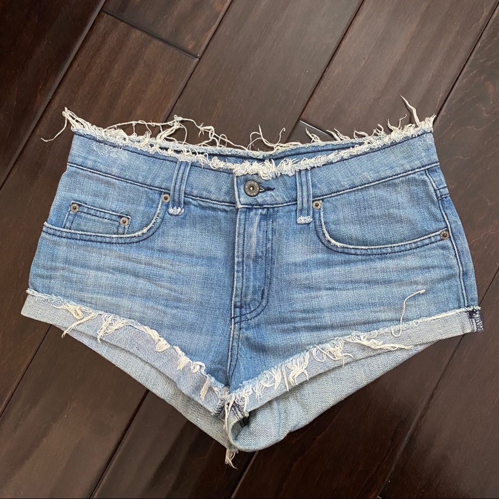 Mid Rise Medium Wash Blue Cheeky Denim Shorts